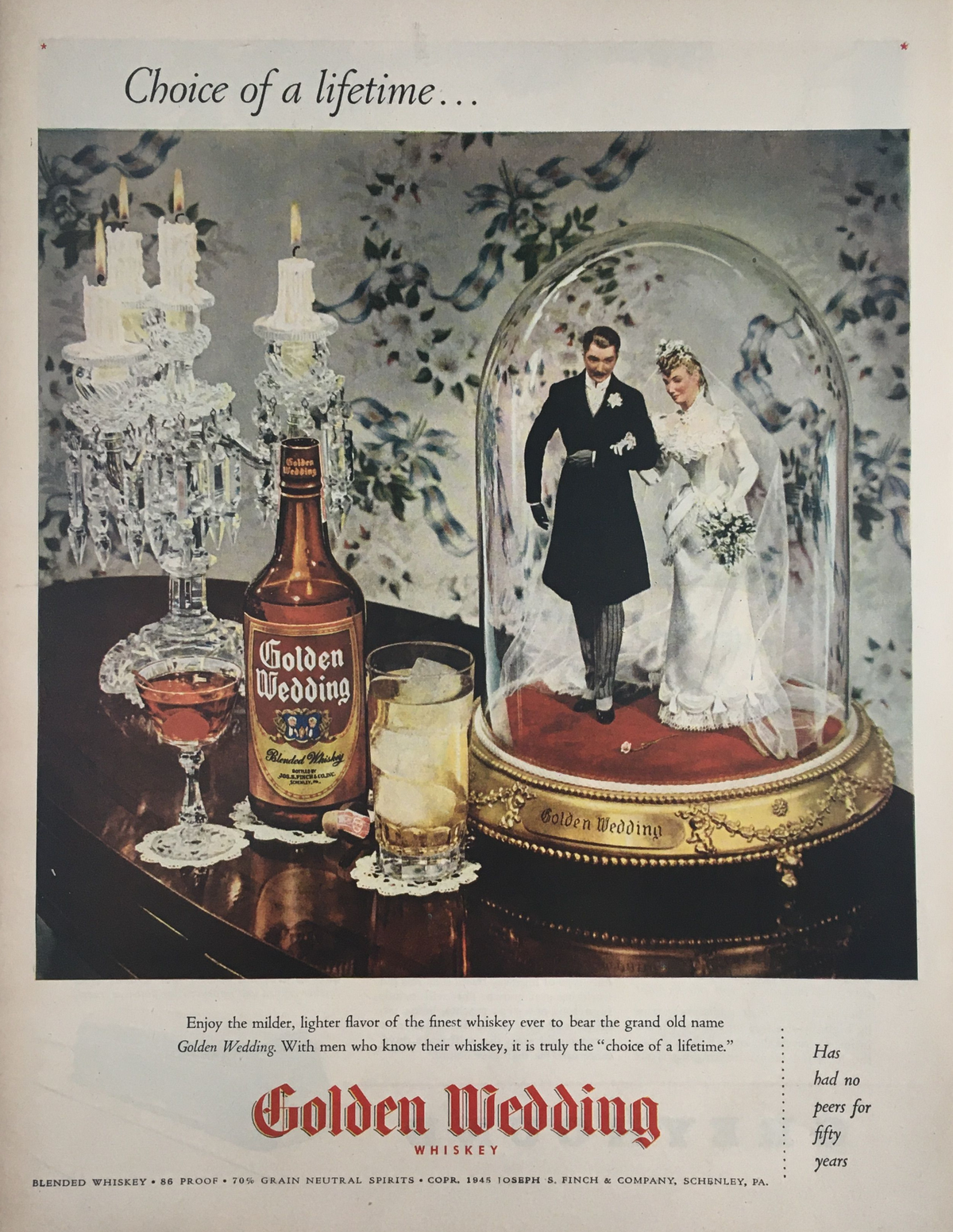 1945 Golden Wedding Blended Whiskey Grain Neutral Spirit Vintage Print Ad featuring an elegant display with a whiskey bottle, crystal glassware, and a wedding couple figurine inside a glass dome, capturing the essence of celebration and nostalgia.