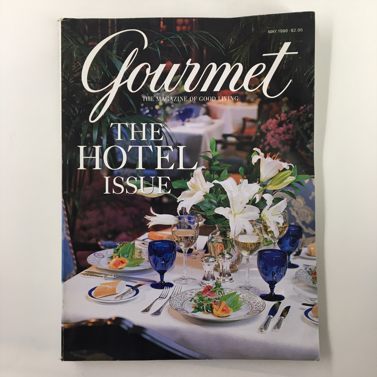 Cover of Gourmet Magazine May 1998 featuring the theme 'The Hotel Issue', showcasing an elegant dining setting with floral centerpieces and fine dining tableware.
