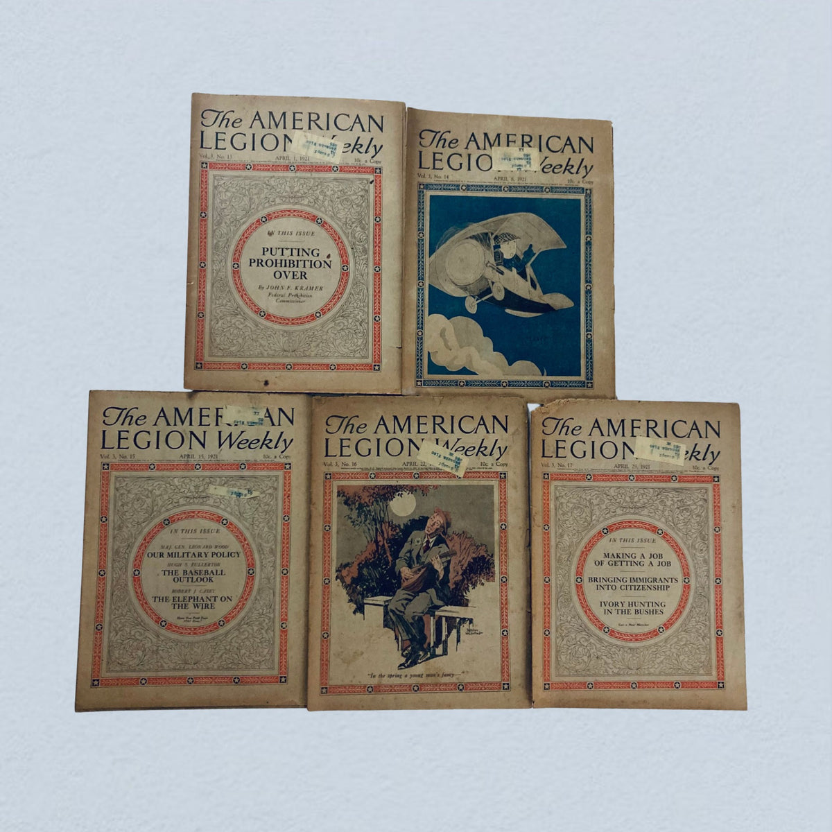 Lot of 40 VTG The American Legion Weekly Magazine January, December 1921 presenting five classic magazine covers, each featuring artistic designs and significant issues from the early 20th century.