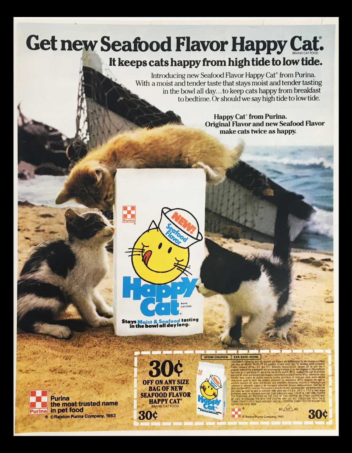 1983 Purina Happy Cat Moist & Seafood Cat Food Circular Coupon Advertisement featuring a playful cat and promotional details for Happy Cat food with a nostalgic vintage style.