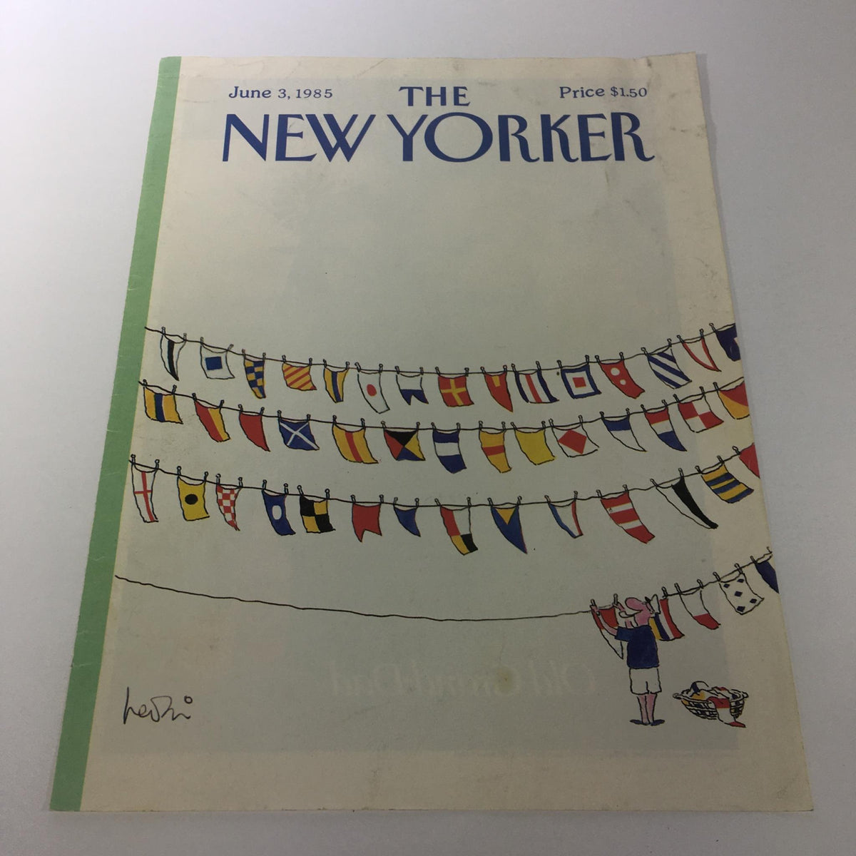 Cover of The New Yorker Magazine June 3, 1985, featuring colorful flags and a character hanging laundry, designed by Heidi Gonnel.