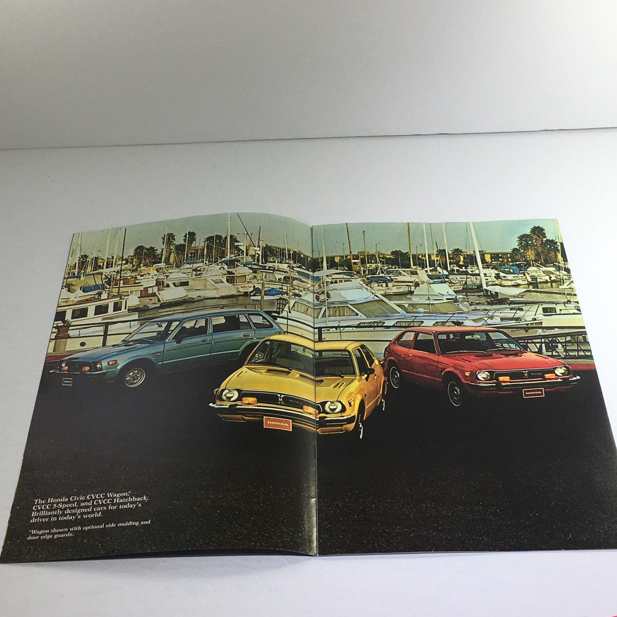 1976 Honda CVCC 5-Speed Wagon Dealership Car Auto Brochure Catalog showcasing three vintage cars parked near a marina.