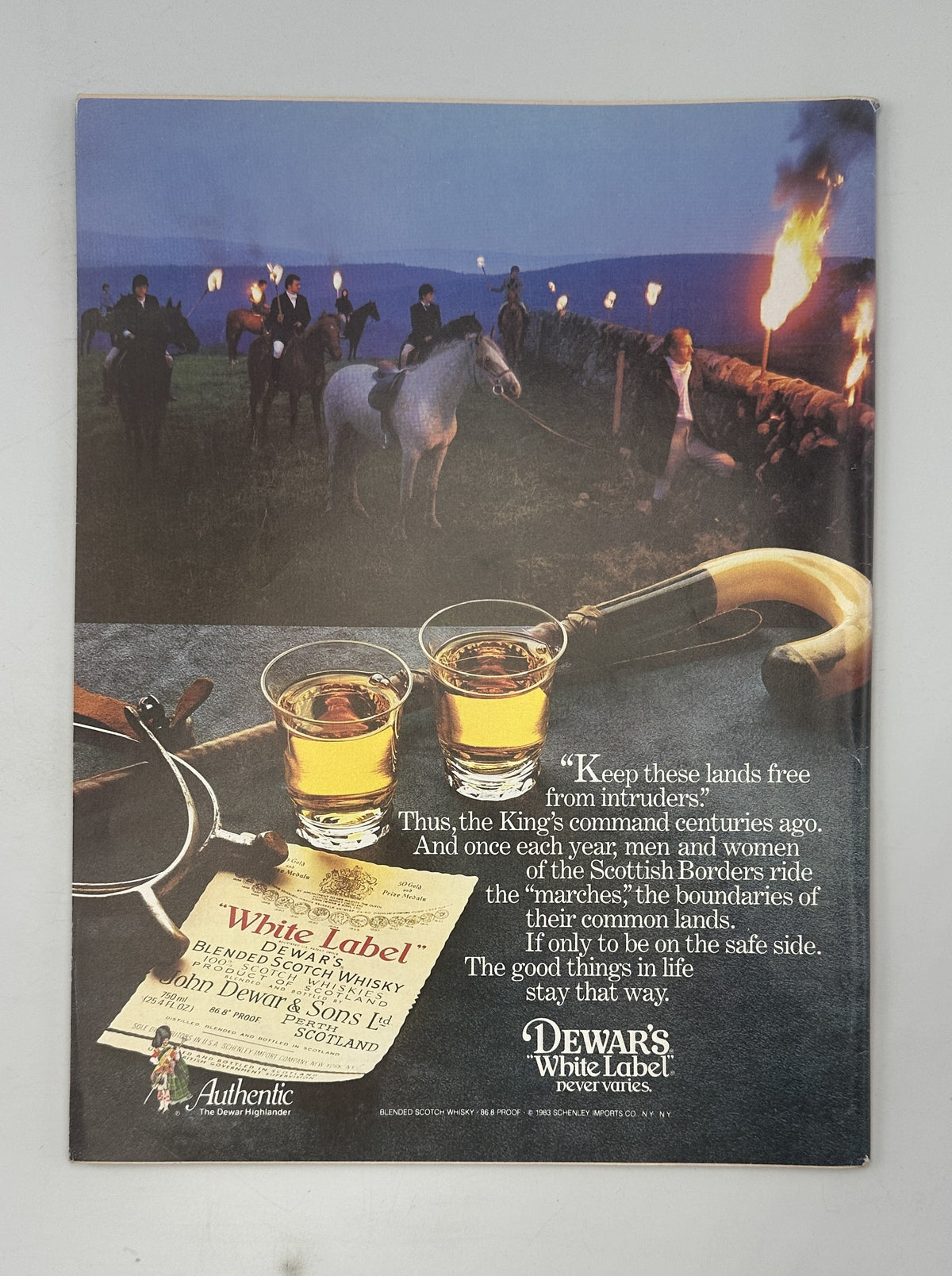 The New Yorker Magazine May 23, 1983 Bear Unicycle City Charles Addams Cover VG, featuring a Dewar's White Label Scotch whisky advertisement with horseback riders, firelight, and drinks outdoors.