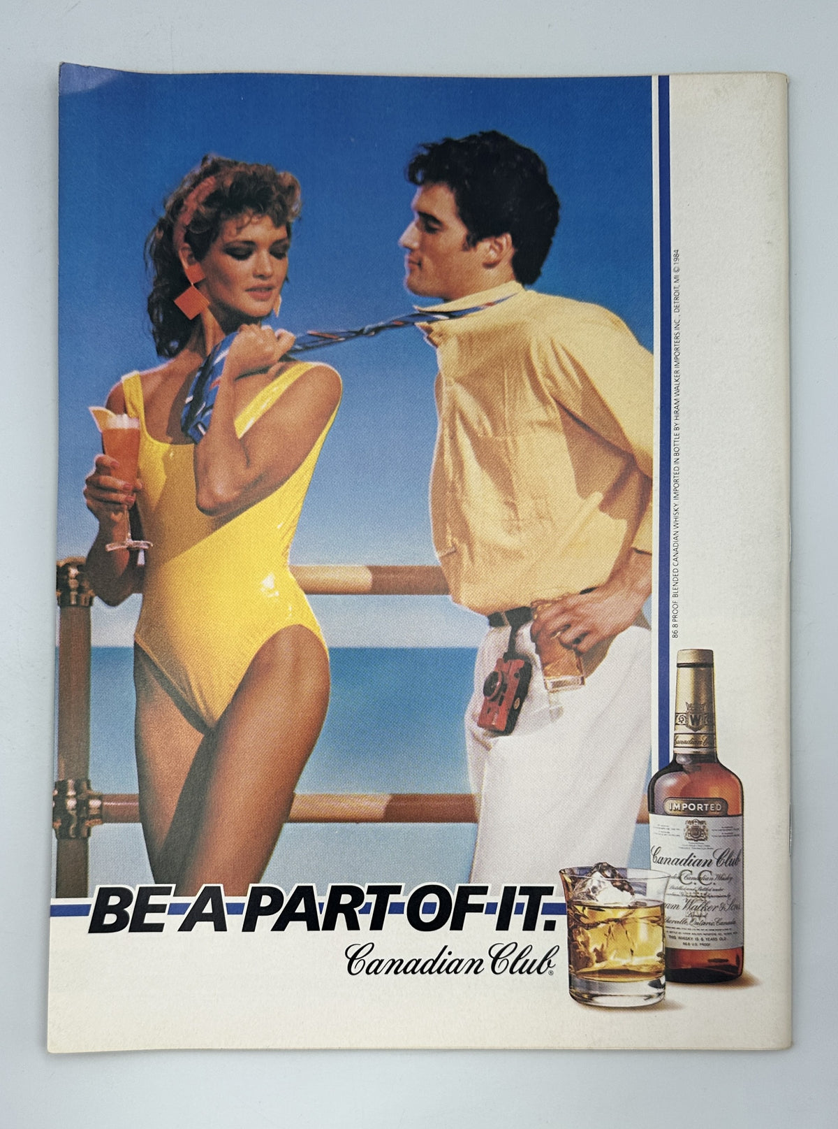 The New Yorker Magazine June 18, 1984 Bridge Joggers Reflection Susan Davis Cover VG, interior advertisement showing a woman and man in resort clothing beside a bottle of Canadian Club whisky.