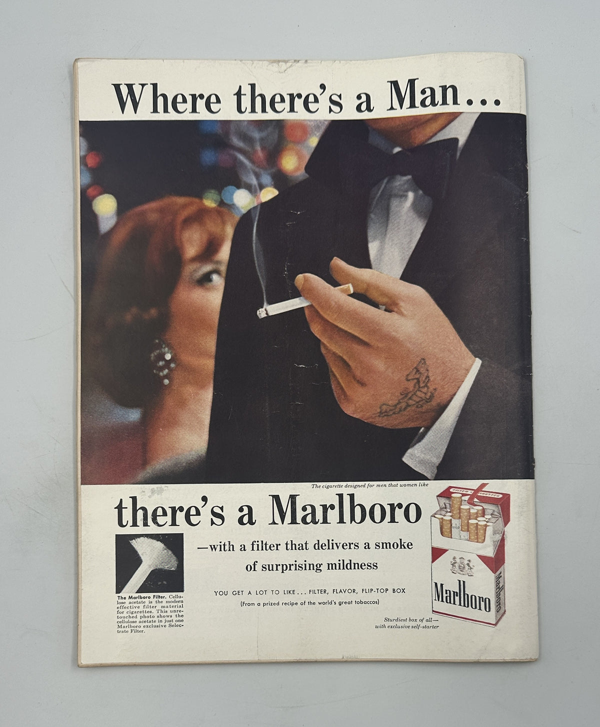 The New Yorker Magazine March 1, 1958 Bedroom Dogs Mary Petty Cover showing a vintage Marlboro cigarette advertisement with a couple at a formal event.