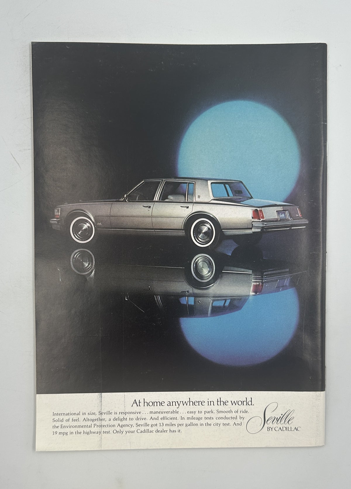 The New Yorker Magazine June 23, 1975 Coastal Rooftops Gretchen Dow Simpson VG, vintage magazine page featuring a classic silver car reflected against a dark background with blue circular lighting.