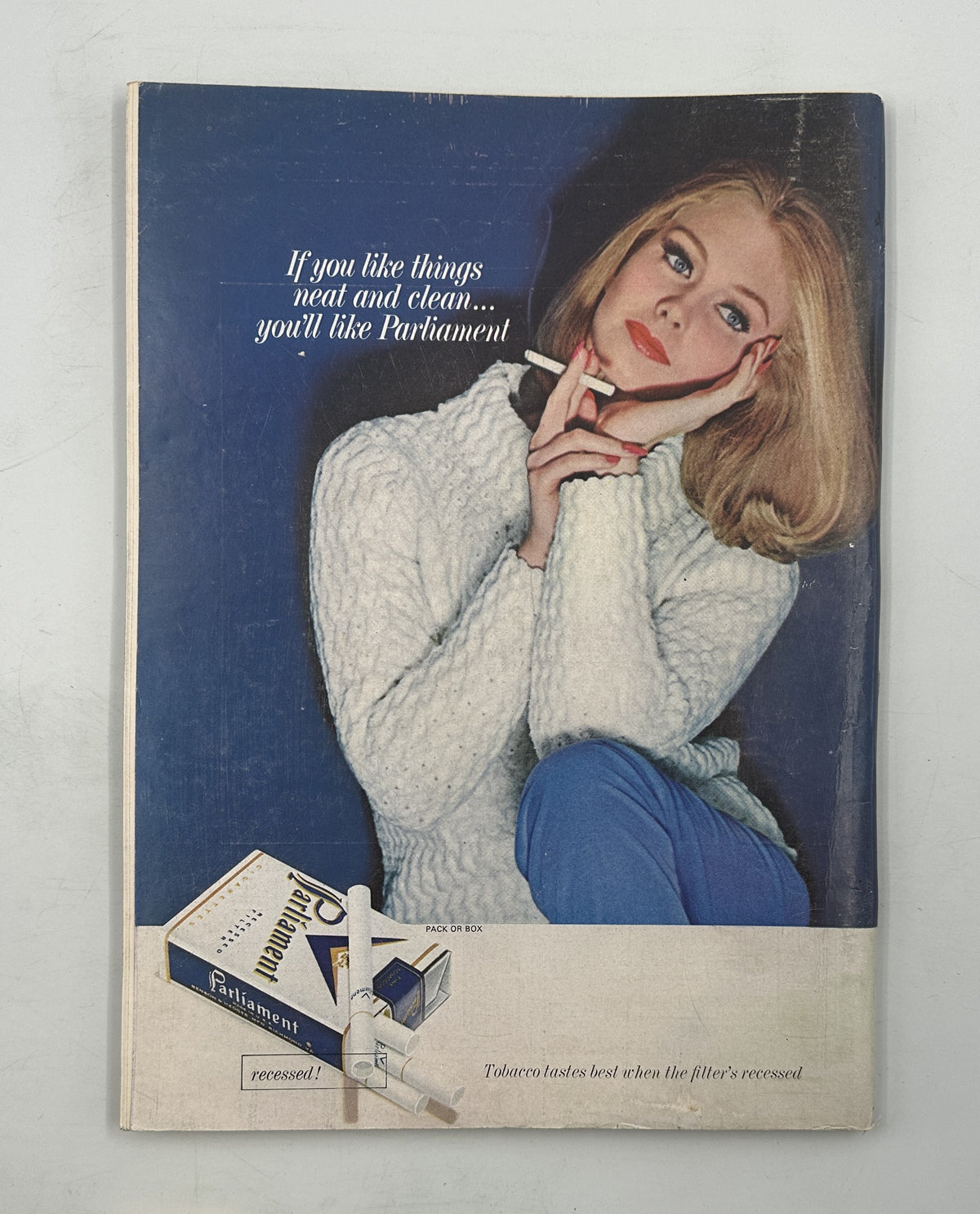 The New Yorker Magazine October 31, 1964 Election Board Church Charles Martin Cover showing a vintage illustrated advertisement featuring a blonde woman in a white sweater and blue trousers.