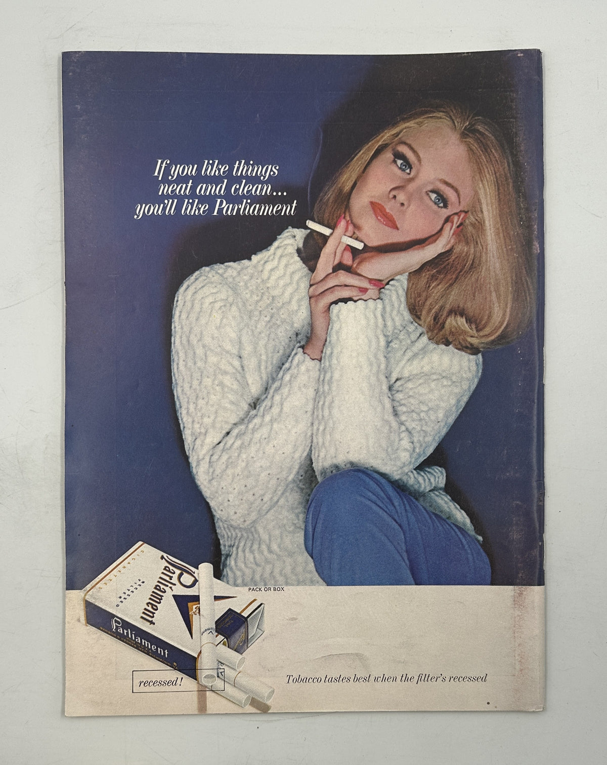 The New Yorker Magazine December 26, 1964 Christmas Angels Rooftop William Steig Cover vintage interior advertisement showing a seated woman in a white sweater promoting perfume