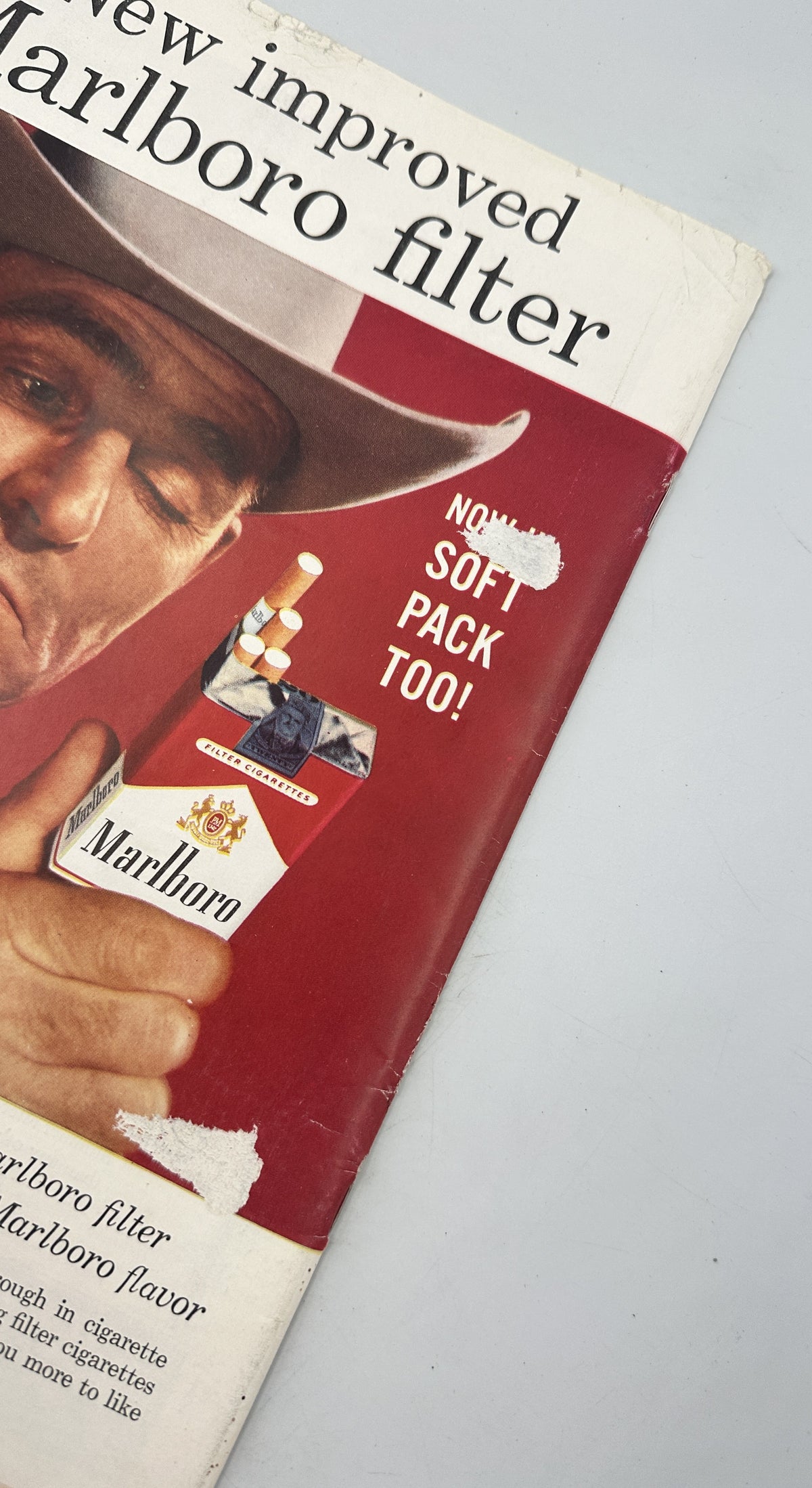 The New Yorker Magazine July 19, 1958 Stained Glass Church Interior Ilonka Karasz, close-up of a vintage Marlboro cigarette advertisement featuring a cowboy and red product packaging