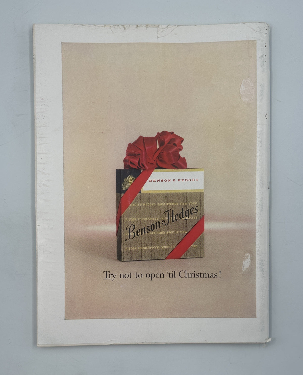 The New Yorker Magazine December 9, 1961 Toy Rockets Space Age Anatol Kovarsky Cover, showing a vintage Christmas-themed magazine page with a wrapped gift advertisement.