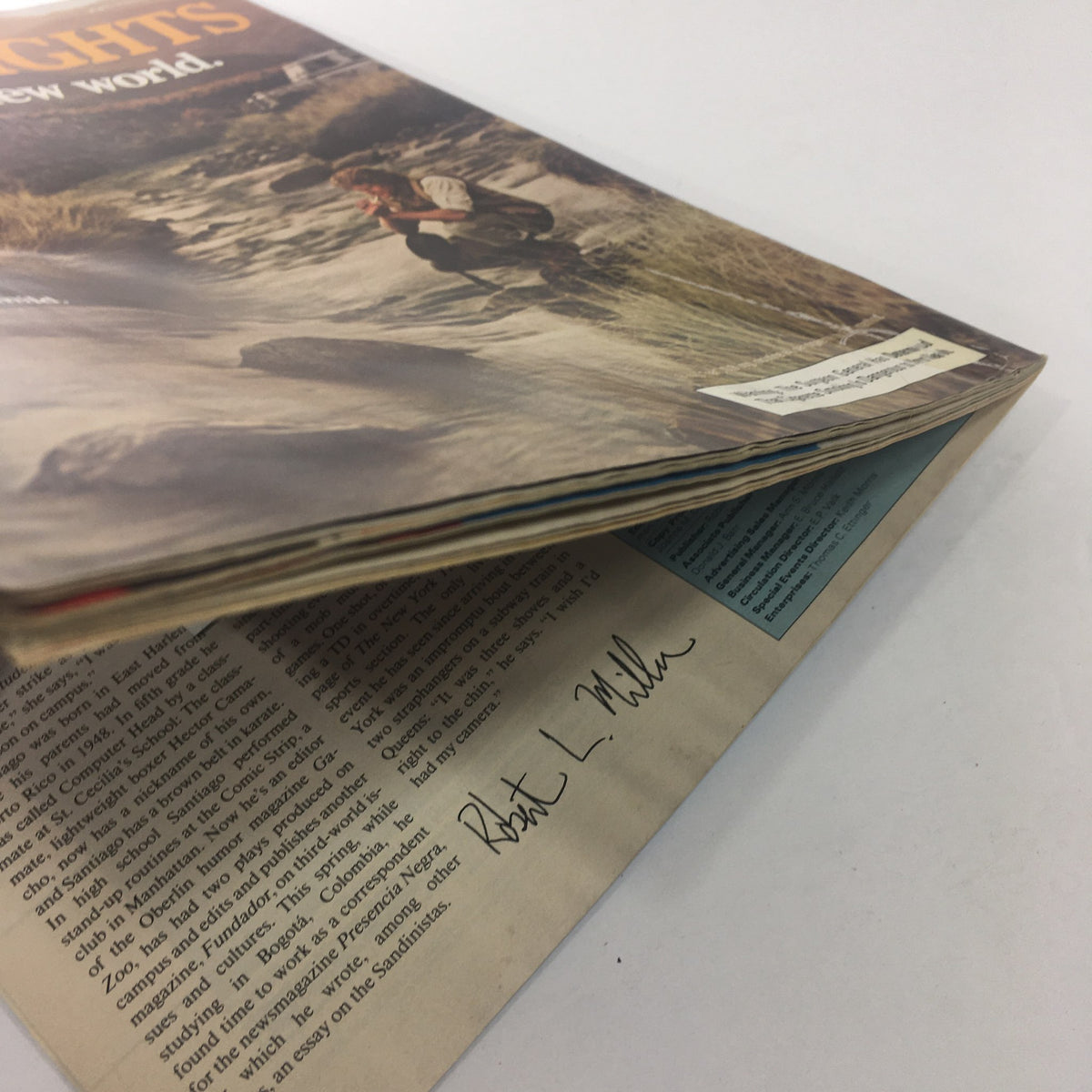 Side view of the Sports Illustrated magazine from July 23, 1984, featuring Michael Jordan on the cover, showcasing light wear and the signature of Robert L. Miller visible on an inner page.