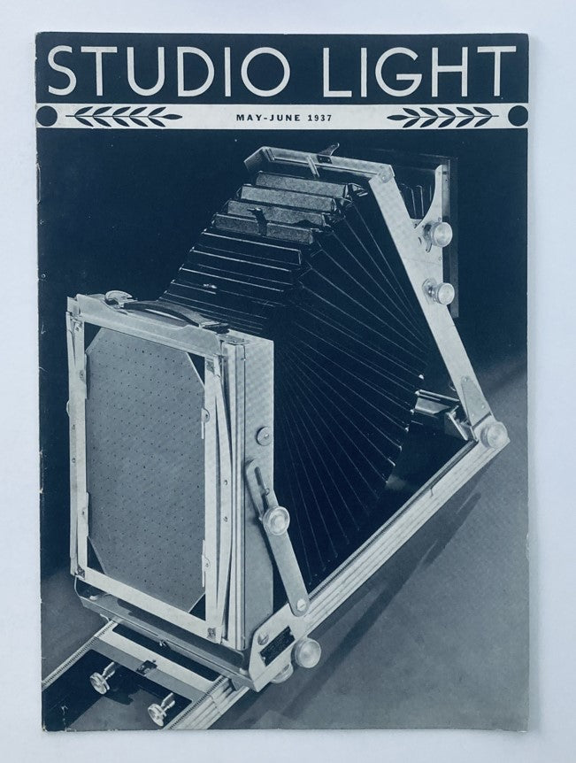 Cover of VTG Studio Light Magazine May 1937 showcasing a vintage camera design, titled 'Studio Light', embodying photography's history.