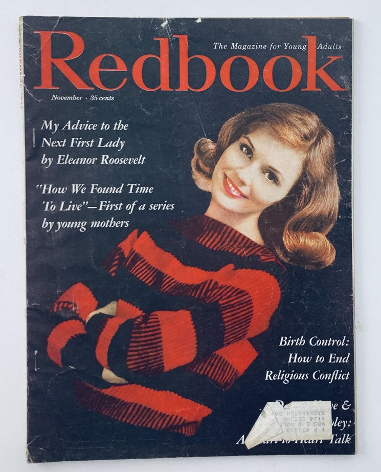 Vintage Redbook Magazine from November 1960, Volume 116, Issue #1. Features the article 'My Advice to the Next First Lady' by Eleanor Roosevelt, showcasing a stylish model in a red and black striped sweater on the cover.