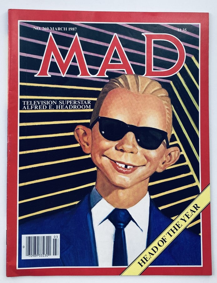 Mad Magazine March 1987 No. 269 featuring Alfred E. Headroom on the cover, showcasing the iconic character in sunglasses and a suit, representing the humor of the late 80s.