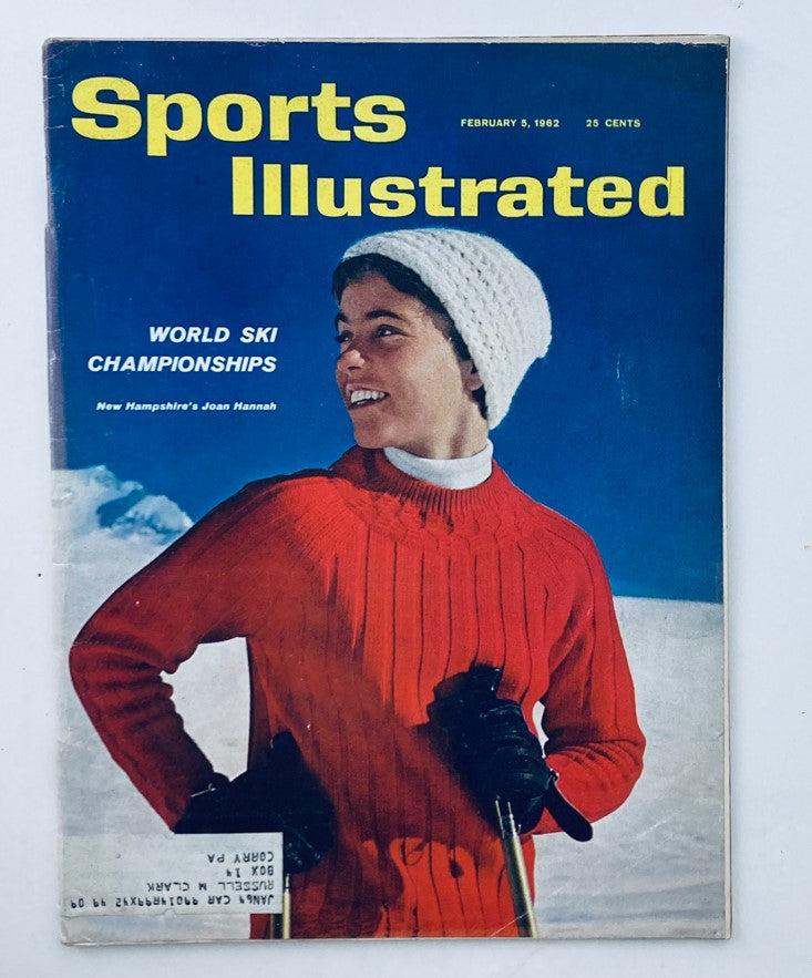 Cover of the Sports Illustrated Magazine, February 5, 1962, Volume 16, Number 5 featuring Joan Hannah. The image showcases her in a red sweater and white hat, with a winter landscape in the background, representing the World Ski Championships.