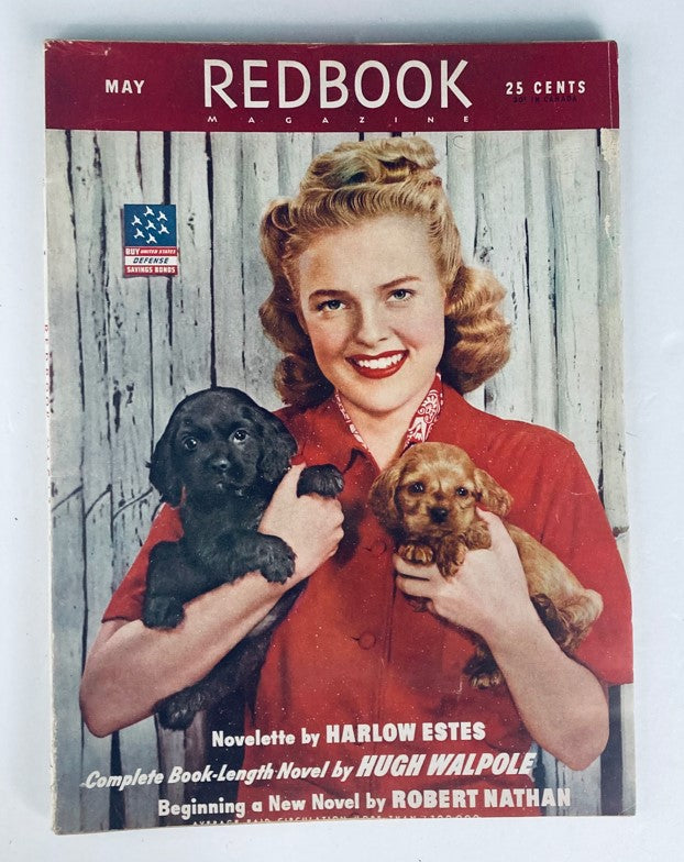 Cover of VTG Redbook Magazine May 1943 featuring a woman in a red dress holding two puppies, highlighting the issue on dream jobs and contributions by Eleanor Roosevelt.