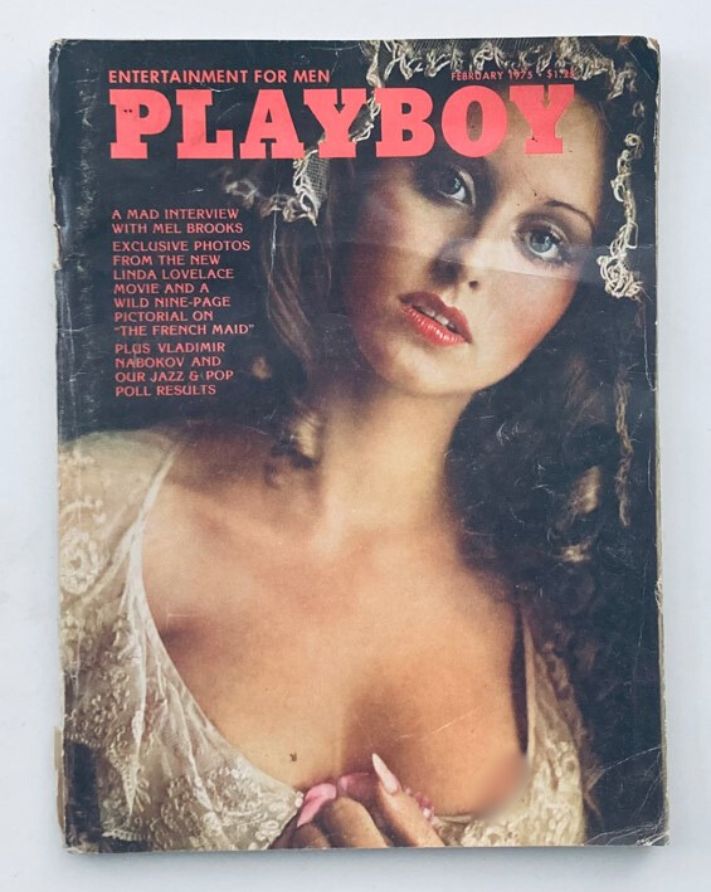 Cover of VTG Playboy Magazine February 1975 featuring Playmate Laura Misch, showcasing her beauty and vintage design.
