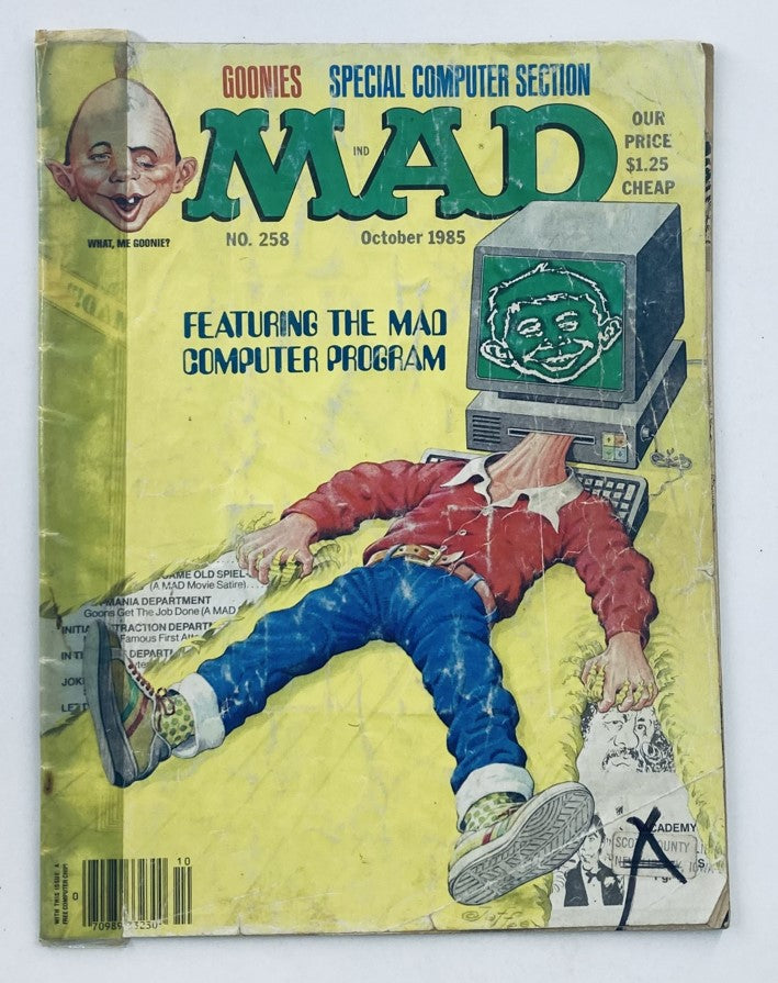 Cover of Mad Magazine October 1985 No. 258 featuring playful artwork and the title 'The Mad Computer Primer 2.0'. The magazine showcases a character with a quirky expression and a computer, capturing the humor of 1980s technology.