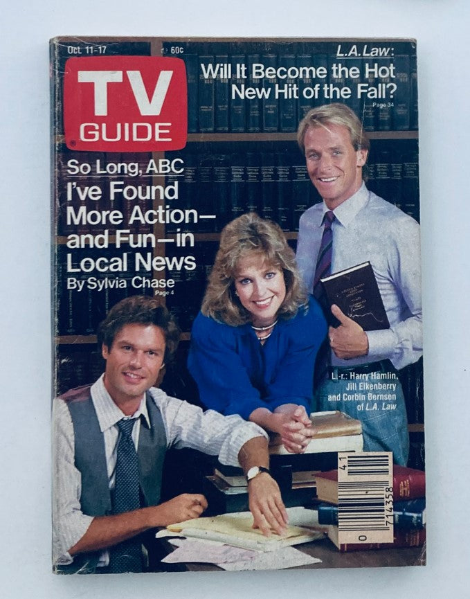 Cover of TV Guide Magazine October 11 1986 featuring Harry Hamlin, Jill Eikenberry, and Corbin Bernsen. The cover discusses topics like 'Will It Become the Hot New Hit of the Fall?' and 'So Long, ABC I've Found More Action and Fun in Local News.' Ideal for collectors of vintage TV memorabilia.