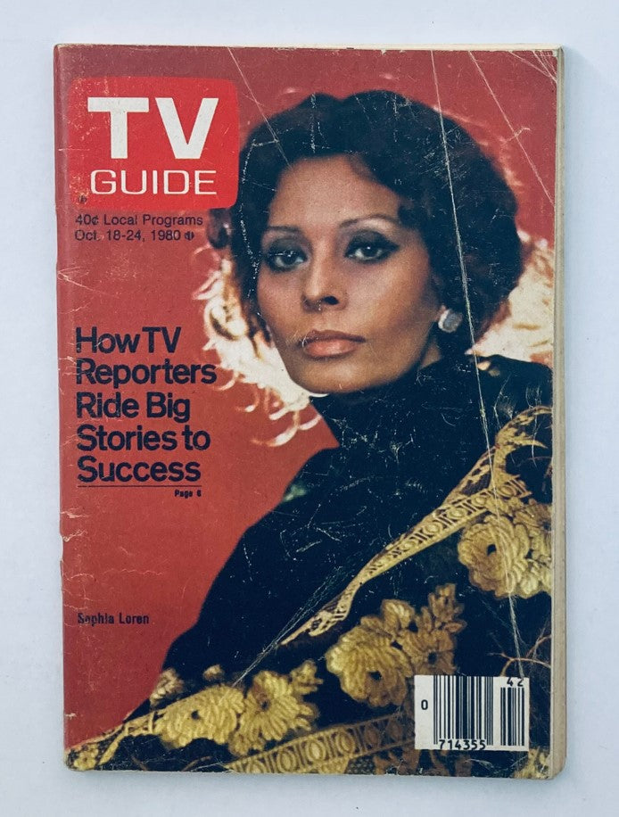 TV Guide Magazine from October 18, 1980 featuring Sophia Loren on the cover. The magazine discusses how TV reporters ride big stories to success, showcasing a vintage design with visible wear and tear that adds to its collectible value.