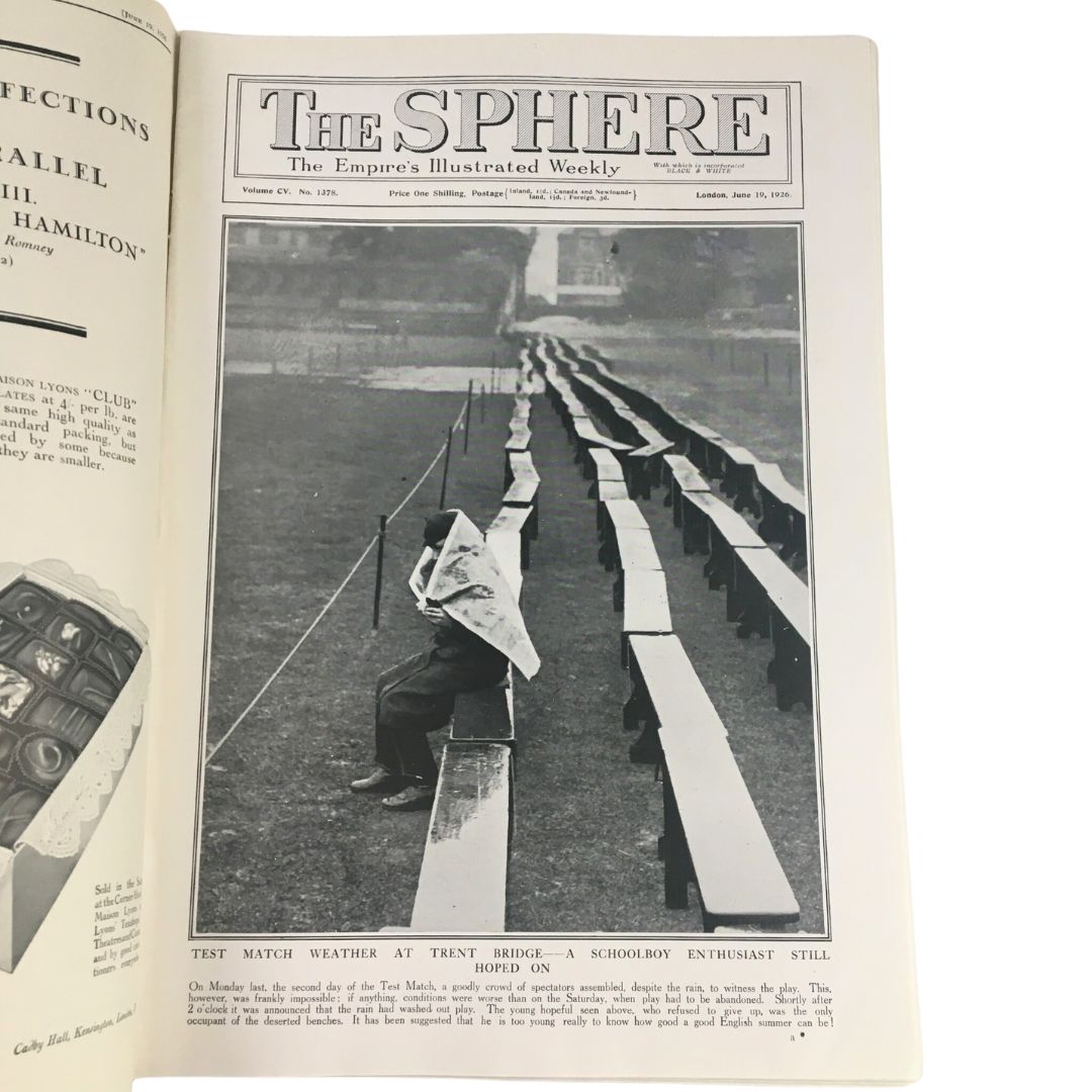 The Sphere Newspaper June 19 1926 featuring a Test Match weather report from Trent Bridge; a schoolboy enthusiast is pictured reading the newspaper while seated on the grass, showcasing a vintage moment in sports journalism.