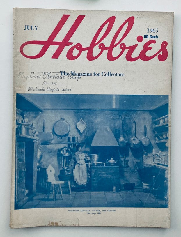VTG Hobbies Magazine July 1965 Vol 70 No. 5 featuring a Miniature Austrian Kitchen, showcasing a vintage kitchen scene with pots, a stove, and a woman in traditional attire.