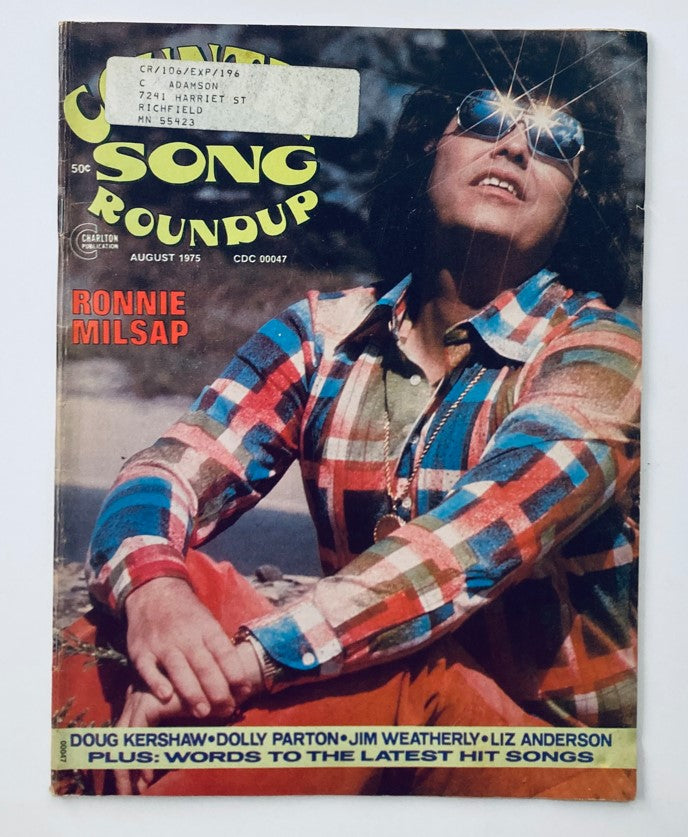 Cover of VTG Country Song Roundup Magazine August 1975 featuring Ronnie Milsap. The cover showcases a vibrant image of Milsap wearing sunglasses and a plaid shirt, emphasizing the iconic style of country music in the 1970s.
