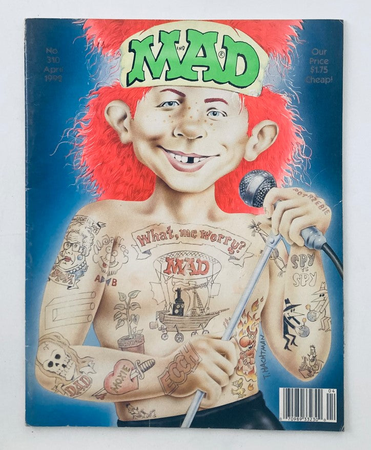 Mad Magazine April 1992 No. 310 cover featuring a humorous illustration of a boy with tattoos and a microphone, encapsulating the '90s rebellious spirit and commentary on tattoos.