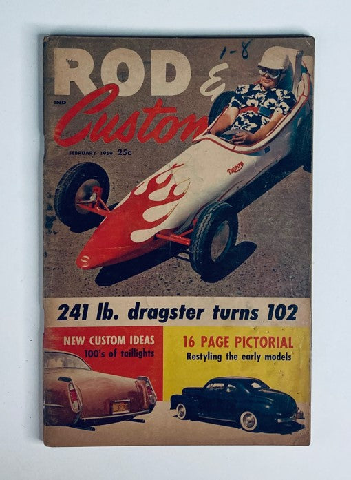 VTG Rod & Custom Magazine February 1959 cover featuring a racer in a stylish dragster with flames, showcasing vintage automotive design.