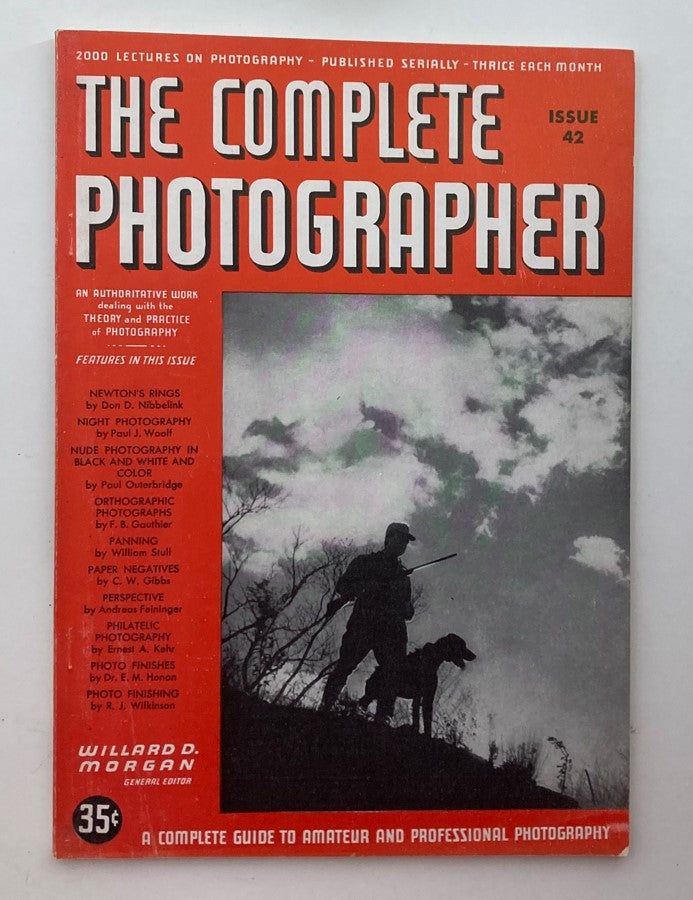 Cover of The Complete Photographer Magazine, November 10, 1942, featuring a silhouette of a photographer and dog against a dramatic sky, highlighting the theme of photography.