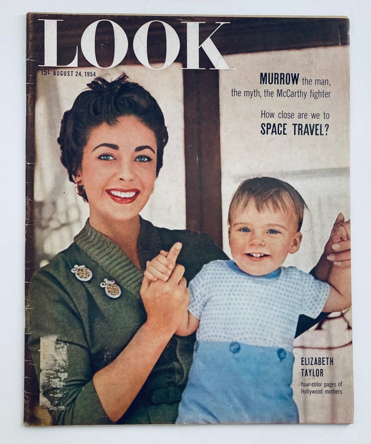 Cover of VTG Look Magazine August 24 1954 featuring Elizabeth Taylor smiling with a child. The magazine showcases mid-20th century fashion and culture.