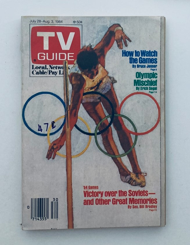 Cover of TV Guide Magazine July 28, 1984 featuring Olympic Mischief WA-Baltimore Ed. Colorful depiction of an athlete participating in the Olympics, surrounded by Olympic rings, capturing the excitement of the 1984 Summer Olympic Games.