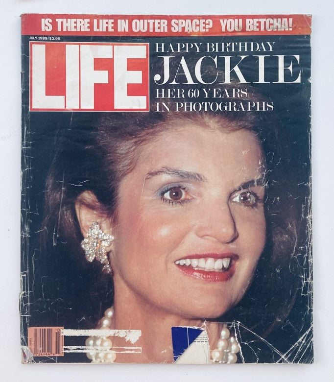 VTG Life Magazine July 1989 featuring Jackie Onassis celebrating her 60 years, with a striking cover photograph depicting her smile and elegant earrings.