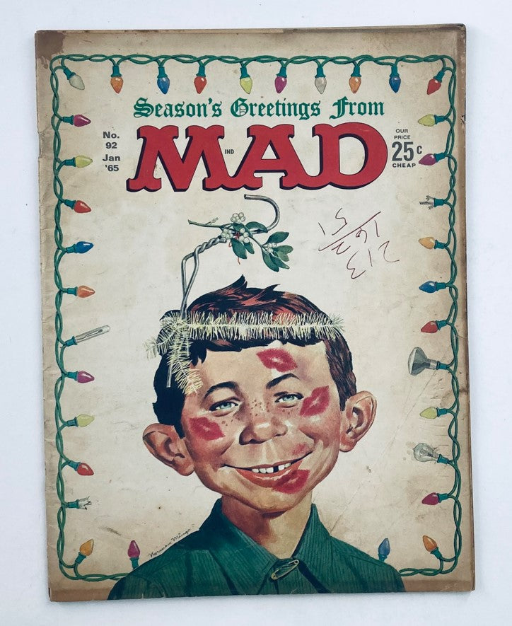 Cover of Mad Magazine January 1965 No. 92 featuring a humorous illustration of a boy with Christmas lights and mistletoe, emphasizing the issue titled 'The Carpetsweepers'.
