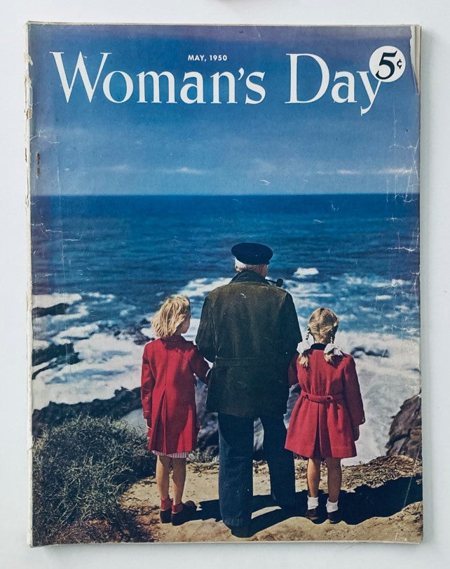 Vintage Woman's Day Magazine cover from May 1950, depicting a man and two girls in red coats overlooking the ocean, emphasizing family life and societal themes from the 1950s.