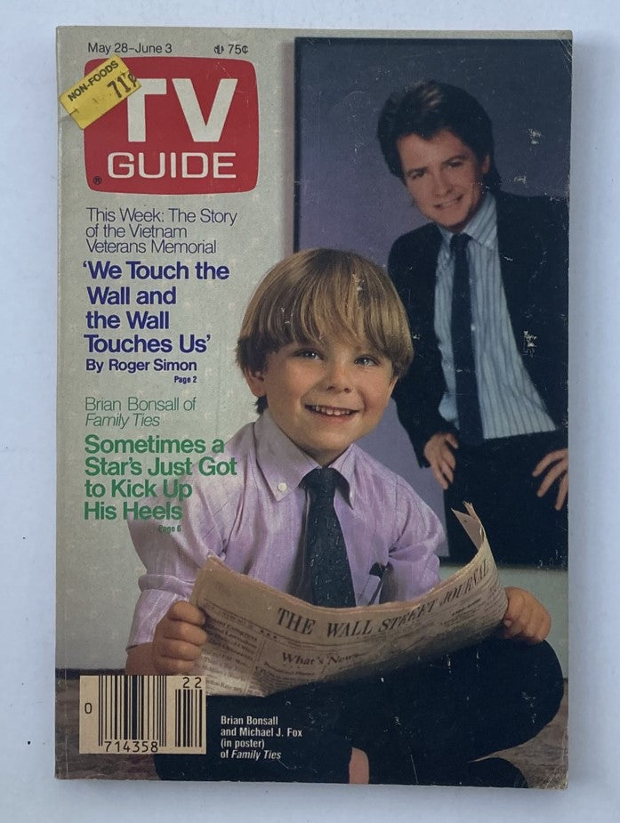 TV Guide Magazine from May 28, 1988, featuring Michael J. Fox and Brian Bonsall from Family Ties on the cover. This vintage magazine highlights articles about the Vietnam Veterans Memorial and entertaining features on popular television shows.