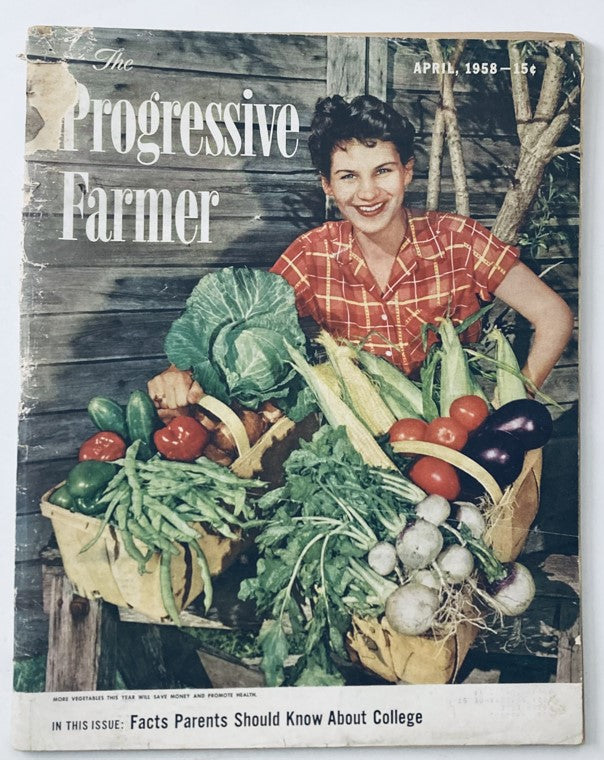 Cover of VTG The Progressive Farmer Magazine April 1958 featuring a woman holding a variety of fresh vegetables, reflecting the theme of good cooking and farming traditions.