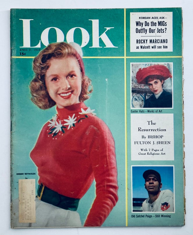 Cover of Look Magazine from April 7, 1953, featuring a cheerful Debbie Reynolds in a red sweater with floral embellishments, along with articles on Easter hats and Satchel Paige.