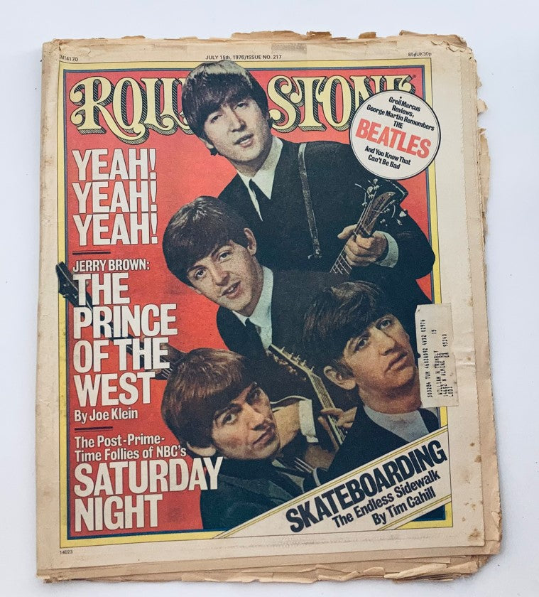 Vintage Rolling Stone Magazine July 15, 1976 Issue 217 featuring The Beatles on the cover, showcasing iconic band members in classic 70s attire.