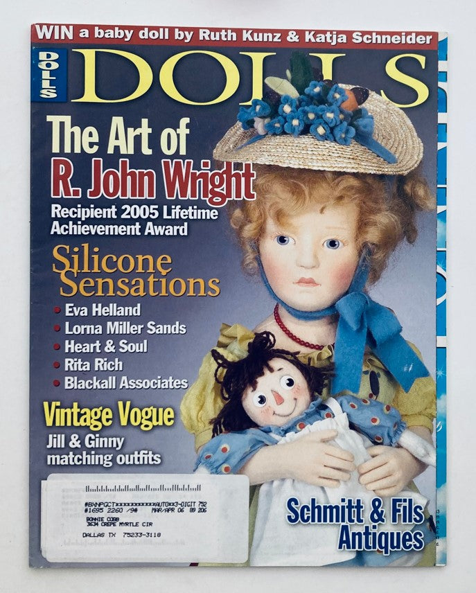 Cover of Dolls Magazine October 2005 featuring The Art of R. John Wright, showcasing a child doll with a blue bow and an accompanying doll, highlighting silicone sensations and vintage outfits.