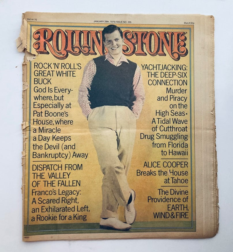 Cover of the Rolling Stone Magazine, January 29, 1976 Issue 205 featuring Pat Boone, showcasing articles on music and culture from the 1970s, with visible aging and wear.