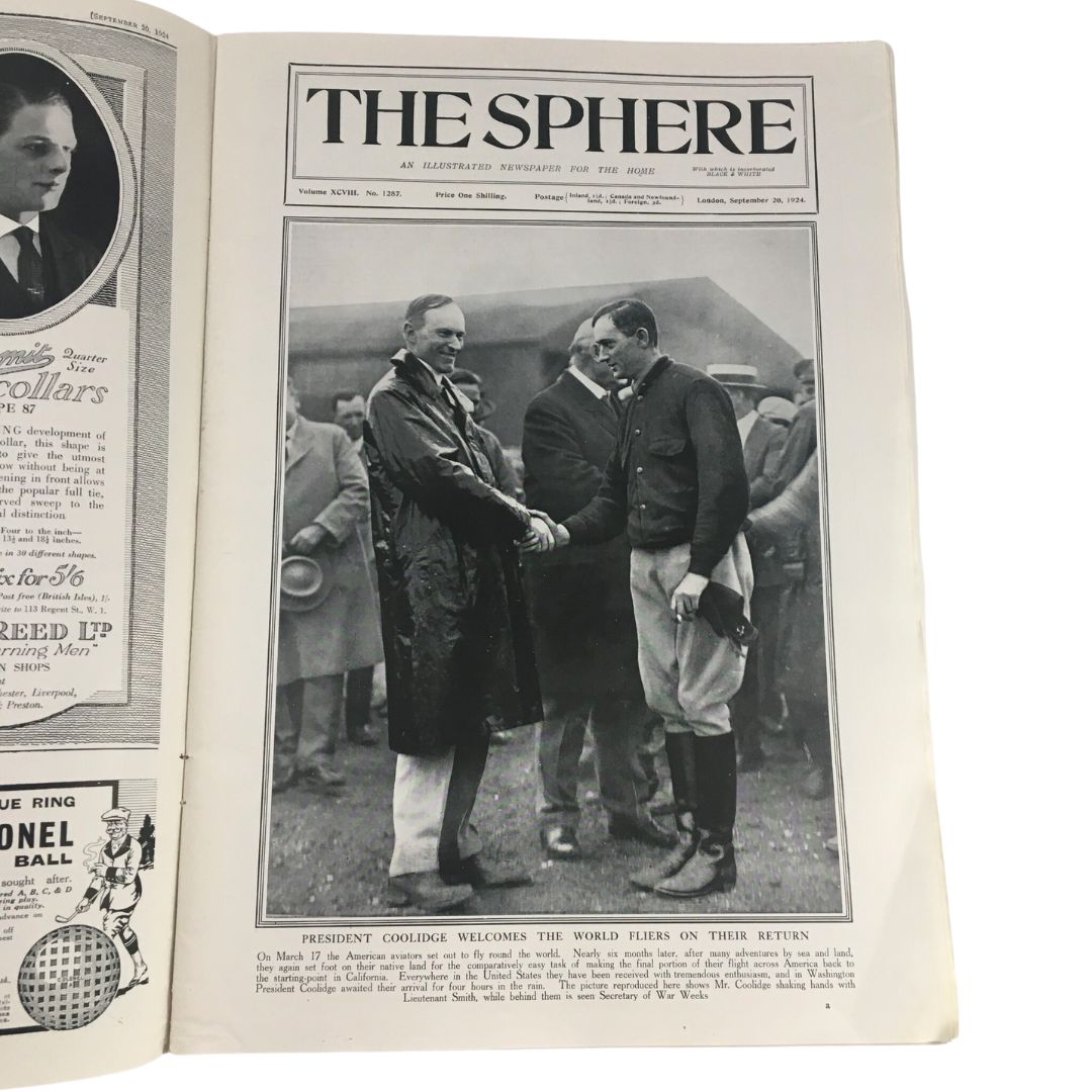 The Sphere Newspaper dated September 20, 1924, featuring a historic cover with President Calvin Coolidge shaking hands with Lieutenant Smith, celebrating their return from a significant mission.