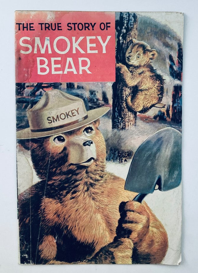 Cover of VTG 1969 The True Story of Smokey the Bear Issue #1 Comic Book featuring Smokey Bear with a shovel and a bear cub in the background.