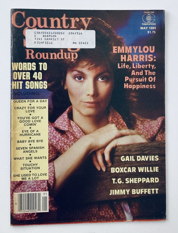 Cover of the VTG Country Song Roundup Magazine May 1985 featuring Emmylou Harris, with a bold headline discussing her article 'Life, Liberty, And The Pursuit Of Happiness', showcasing her involvement in the vibrant country music scene alongside Gail Davies.