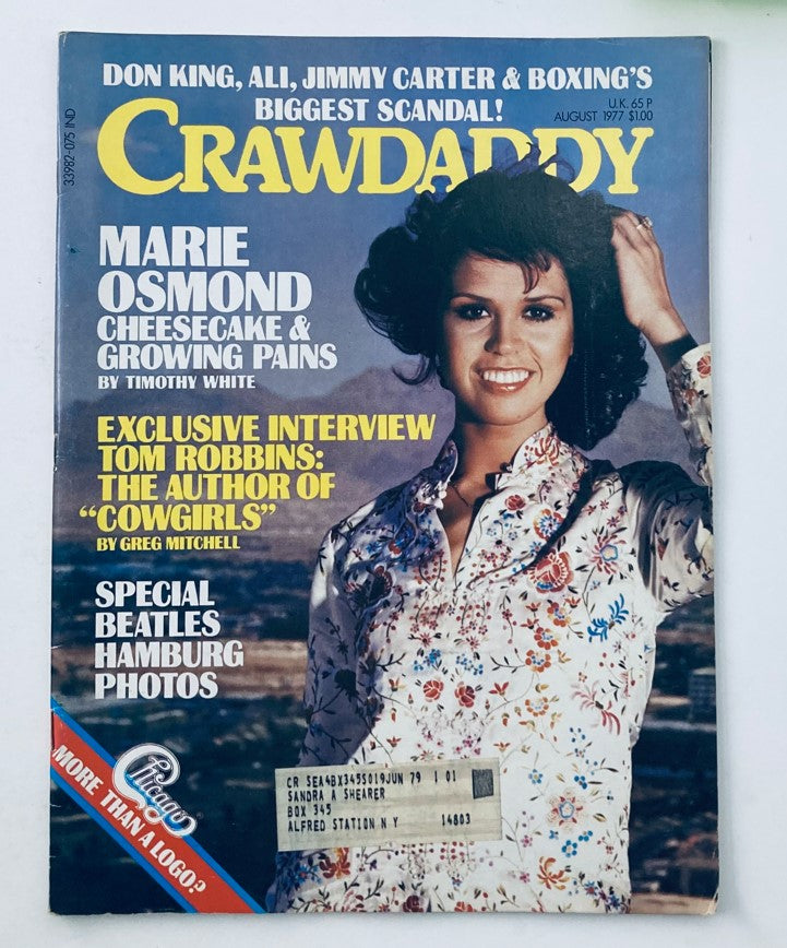 Vintage Crawdaddy Magazine cover from August 1977 featuring Marie Osmond and special content on The Beatles and Don King. The cover showcases vibrant colors and cultural references from the late 1970s.