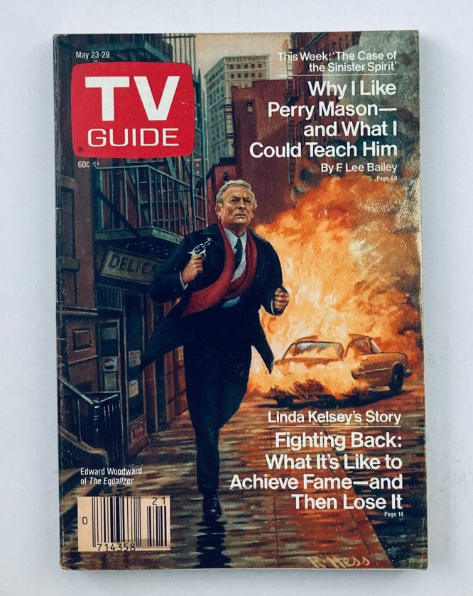 Cover of TV Guide Magazine May 23 1987 featuring Edward Woodward on the front, surrounded by an illustrated scene of a city street with a dramatic explosion.