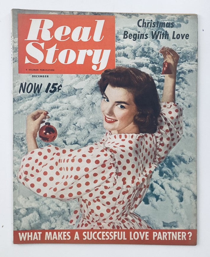 Cover of VTG Real Story Magazine December 1954 featuring a woman with a Christmas ornament, titled 'Christmas Begins with Love'.