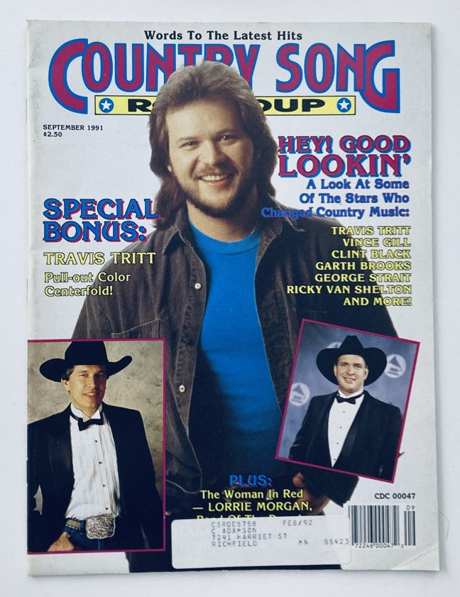 Cover of Country Song Roundup Magazine from September 1991 featuring artists Travis Tritt and Vince Gill, highlighting their popular songs, with bold text stating 'Hey! Good Lookin'' and a special bonus section dedicated to Travis Tritt.