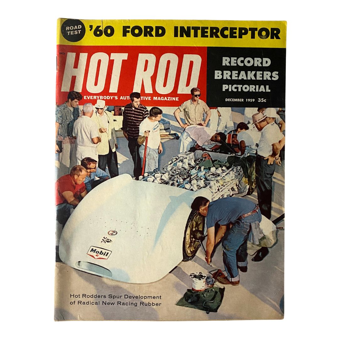 Cover of VTG Hot Rod Magazine December 1959 featuring a group of men around a car, highlighting Radical New Racing Rubber innovation.
