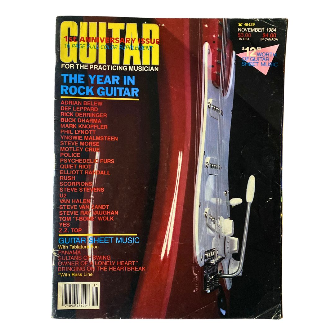 Vintage Guitar Magazine November 1984 cover featuring the title 'The Year in Rock Guitar'. The cover showcases notable guitarists and musicians, highlighted by a striking image of a guitar.